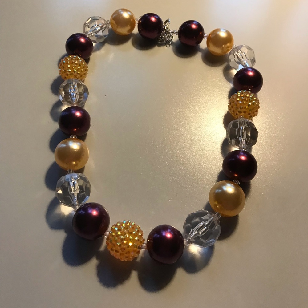 Beautiful maroon and gold statement necklace.